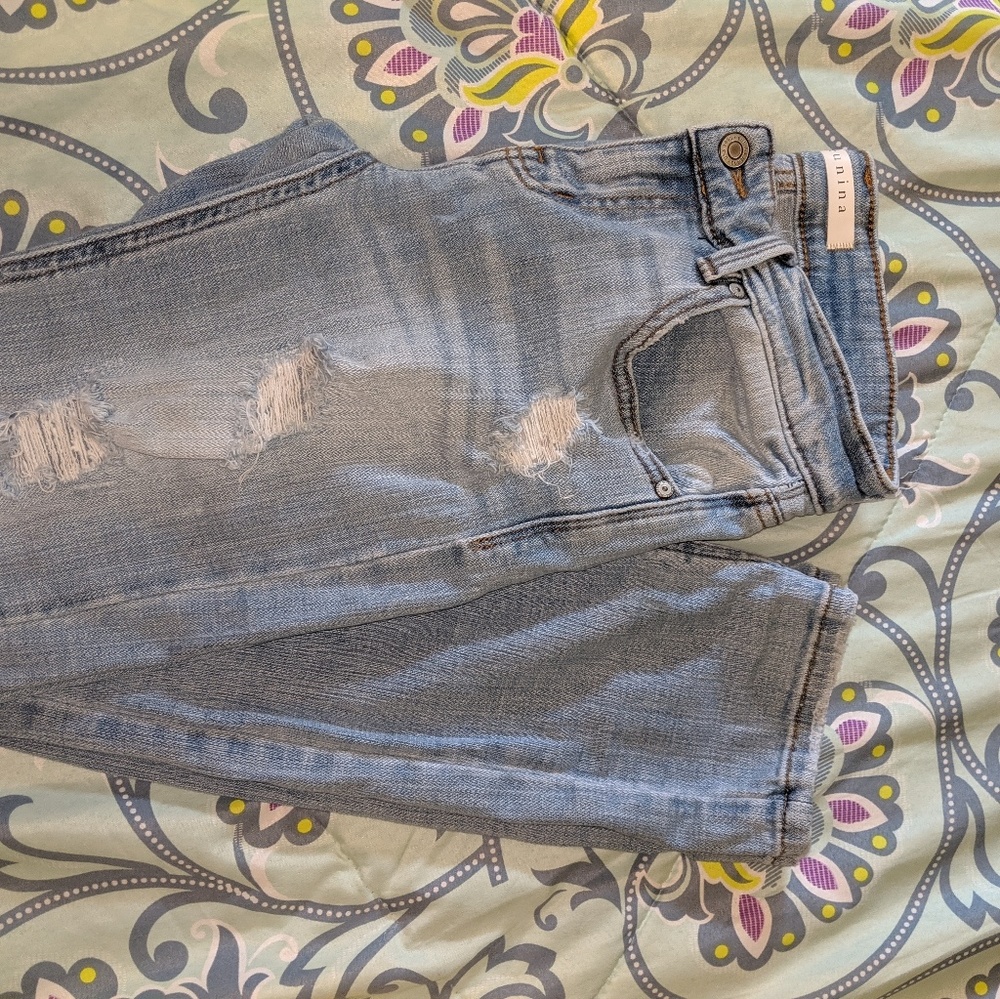 Light wash distressed skinny jeans